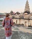 Uma embroidered reversible jacket in powder pink. Lång vändbar broderad kappa i puderrosa.
